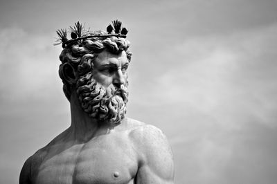 Low angle view of statue against cloudy sky