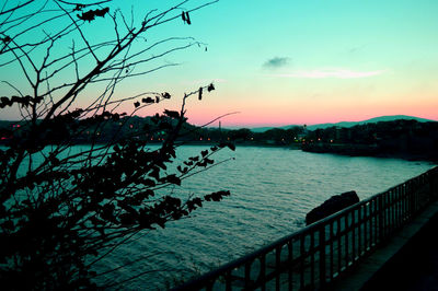 Scenic view of river at sunset