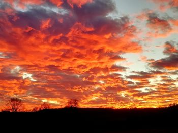 Low angle view of dramatic sky during sunset