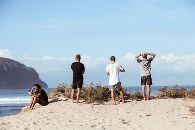 Young people at the beach at sunny day