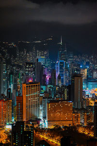 High angle view of illuminated buildings in city at night