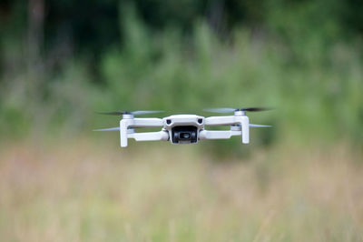 Airplane flying over field