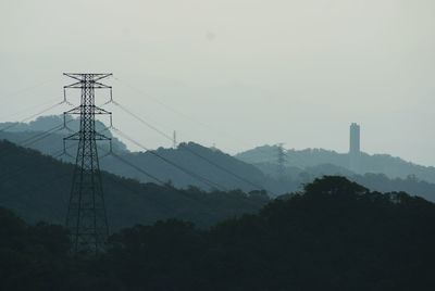 Electricity pylon against sky