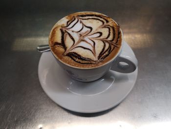 High angle view of cappuccino on table