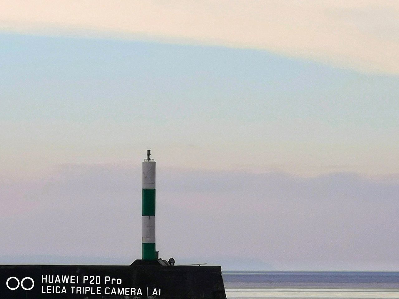 LIGHTHOUSE AGAINST SKY