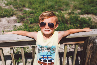 Portrait of boy wearing sunglasses outdoors