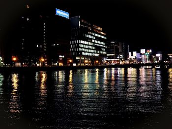 Buildings in city at night