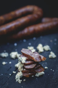 Close-up of meat with condiment on table