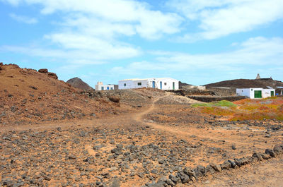 Houses and buildings against sky in fuerteventura, spain