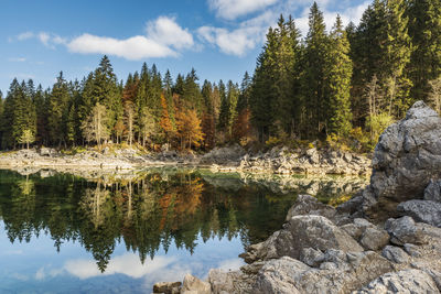 Upper lake of fusine, tarvisio. autumnal fire reflections. at the foot of the mangart