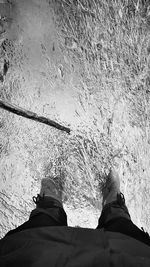 Low section of man standing on floor