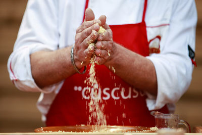 Close-up of man preparing food