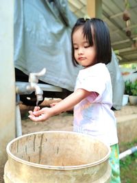 High angle view of cute girl preparing food