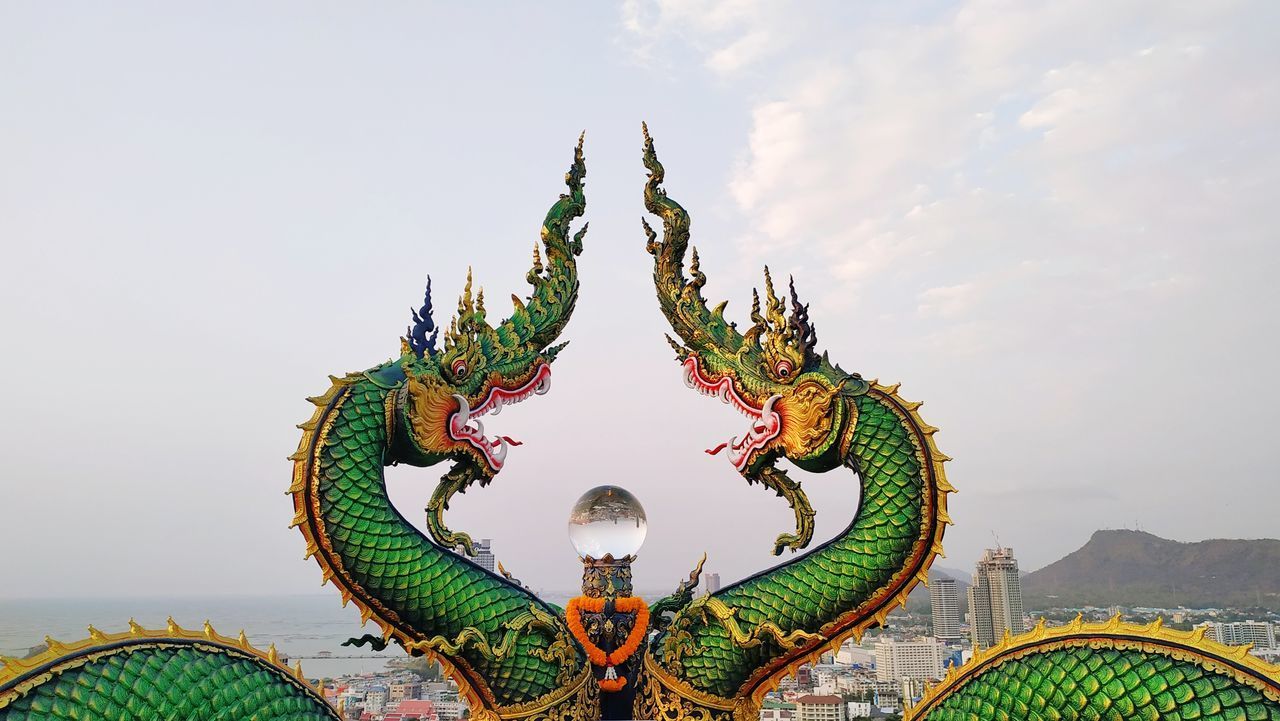 LOW ANGLE VIEW OF SCULPTURE AGAINST SKY