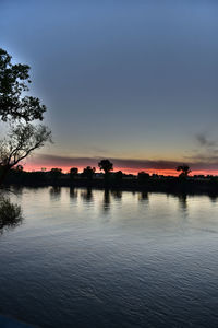 Scenic view of lake at sunset