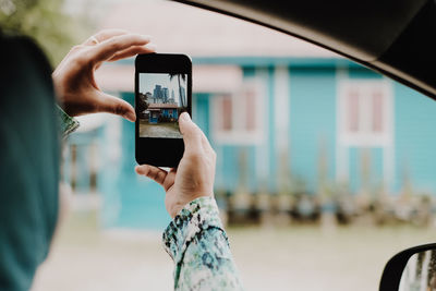 Man photographing with mobile phone