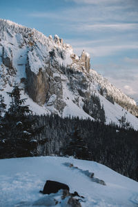 Scenic view of snowcapped mountains against sky