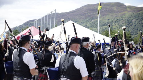 Musicians playing bagpipes during event