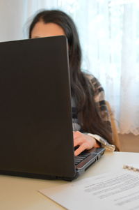 Close-up of senior man using laptop