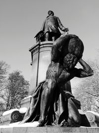 Low angle view of statue against sky