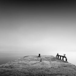 Pier amidst sea against sky during foggy weather