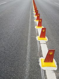 High angle view of arrow symbol on road in city