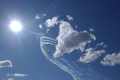 Low angle view of airshow in sky