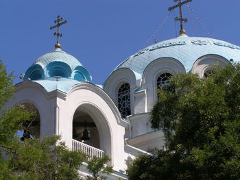 Low angle view of bell tower against sky