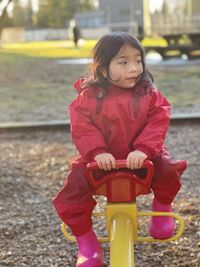 Toddler riding seesaw