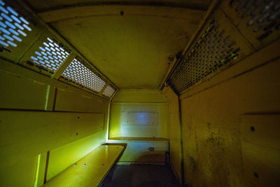 Low angle view of empty corridor in building