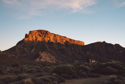 Rock formation on land against sky