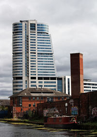 Modern buildings against sky in city