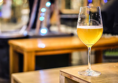 Close-up of beer glass on table