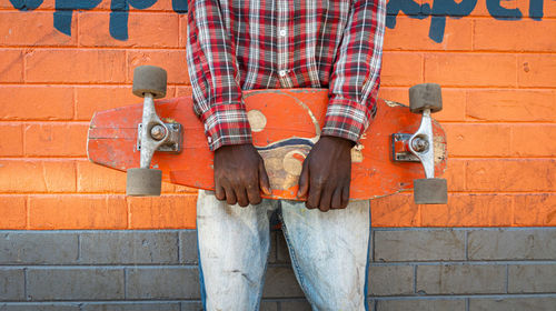 Low section of man standing on footpath