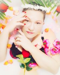 Portrait of woman with pink flower