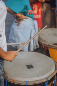 Midsection of man playing music concert