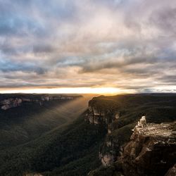 Aerial view of landscape against cloudy sky