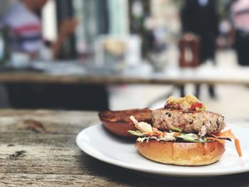 Close-up of burger in plate on table