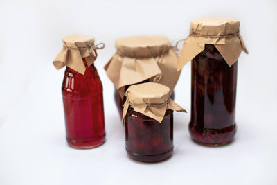 Close-up of drink in jar against white background