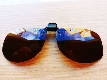 Close-up of sunglasses on table