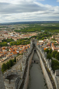 High angle view of buildings in town against sky