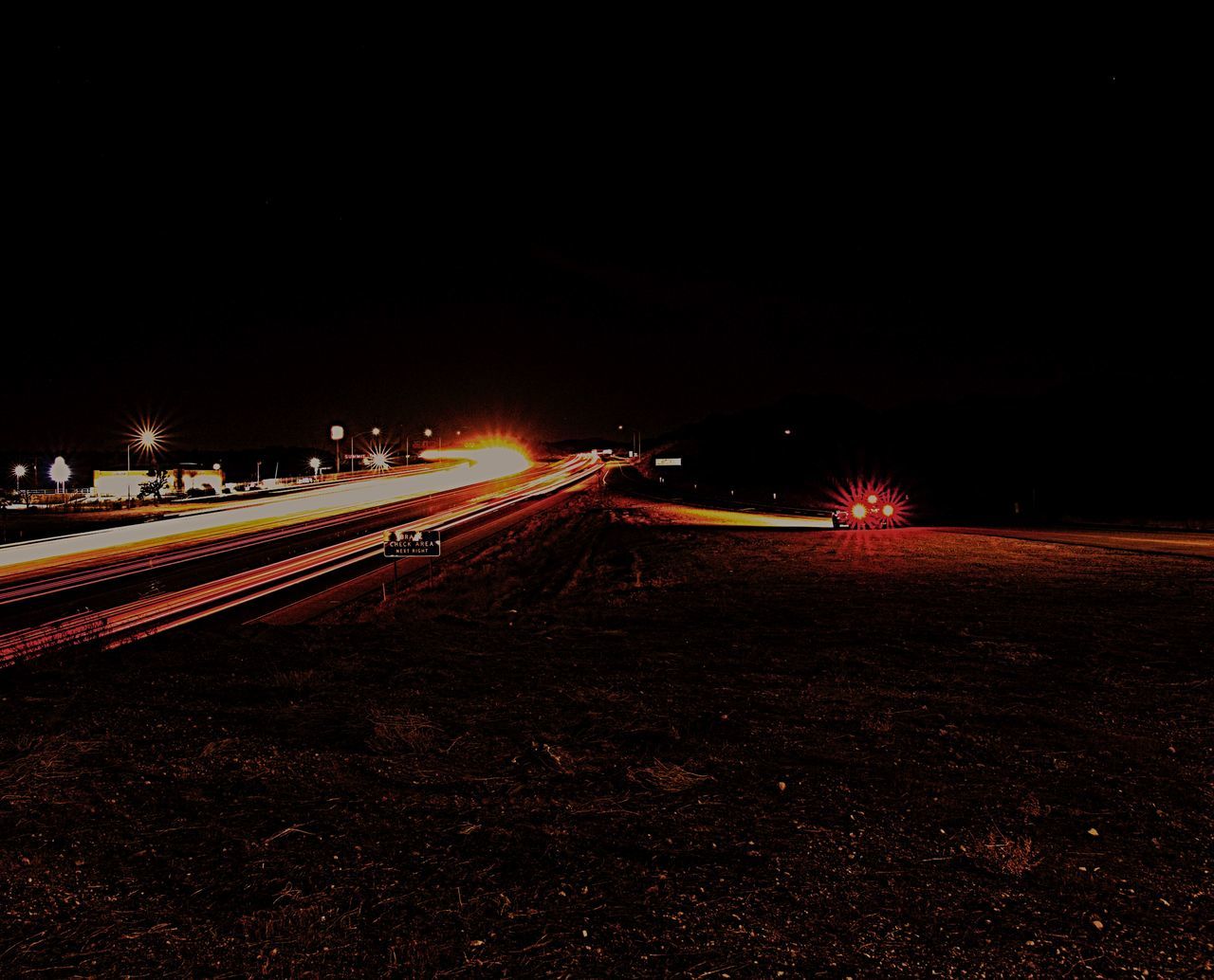 night, illuminated, long exposure, light trail, motion, speed, blurred motion, high street, outdoors, no people, road, clear sky, city, sky