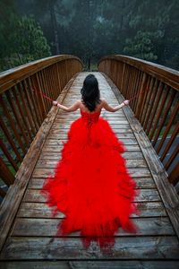 Rear view of woman with red umbrella