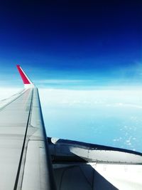 Airplane wing against sky