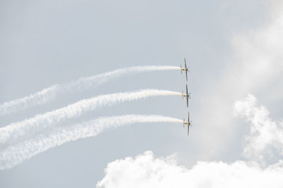 Low angle view of airplane against sky