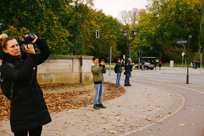 People photographing at camera