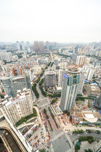 High angle view of illuminated city buildings against sky