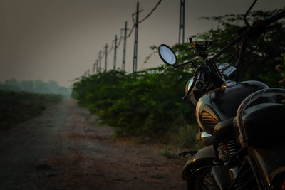 Bicycle riding motorcycle on road in city