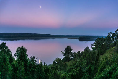 Scenic view of lake against sky at sunset