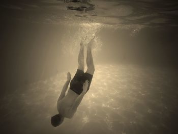 Woman swimming in sea